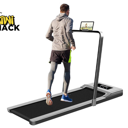 Person using a treadmill with a screen displaying content, branded 'Kiwi Shack'.