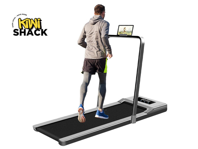 Person using a treadmill with a screen displaying content, branded 'Kiwi Shack'.