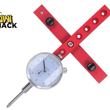 A red metal dial indicator with a silver gauge face and probe, shown on a white background with the Kiki Shack logo in the top-left corner.