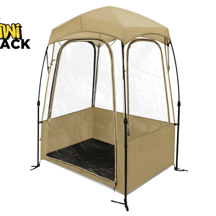 Beige outdoor canopy tent with clear sides on a white background, featuring the Kiwi Shack brand.
