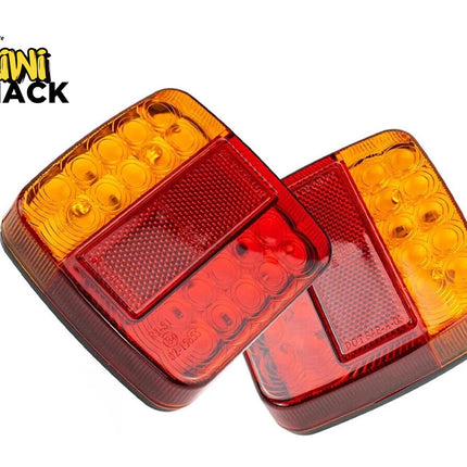 Pair of square amber and red LED trailer tail lights with integrated reflectors, with the Kiwi Shack logo in the top left.