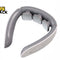 Grey and white U-shaped electronic neck massager / cervical massage device featuring three floating electrode massage pads along the inner curve, ergonomic flexible hinge arms, a control button area on the side grip tip, and the Kiwi Shack logo watermark.