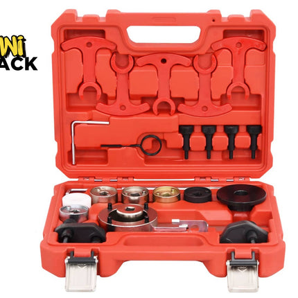 An open red plastic tool case containing a set of mechanical hand tools, including wrenches, sockets, and ring wrenches, on a white background. The Kiwi Shack logo is visible in the top-left corner.