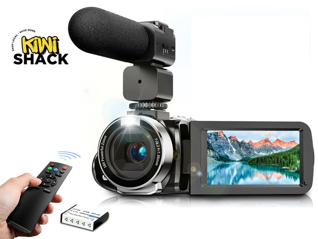 Digital camera with microphone, remote control, and battery pack on a white background with 'Kiwi Shack' branding.