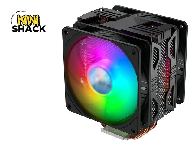 A black CPU cooler heatsink with an RGB LED fan showing a rainbow color spectrum, featuring a copper heat pipe and a mounting bracket, on a white background with a Kiwi Shack logo in the top-left corner.