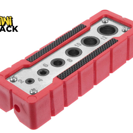 A metal thread gauge and size checker block encased in a protective red rubber housing with numbered sizing slots, set against a white background with the "Kiwi Shack" logo in the top left corner.