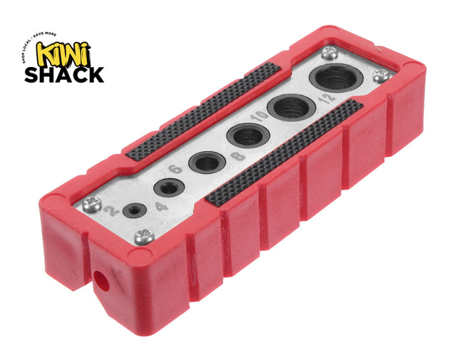 A metal thread gauge and size checker block encased in a protective red rubber housing with numbered sizing slots, set against a white background with the "Kiwi Shack" logo in the top left corner.