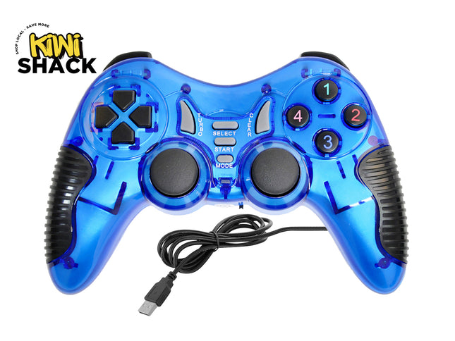 A transparent blue USB wired gaming controller with dual analog sticks, directional pad, numbered action buttons, and textured black grips, featuring the "Kiwi Shack" logo in the top-left corner.