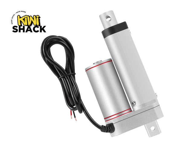 An aluminum linear motor or servo drive with a black and silver cylindrical body, a black cable with red and white wire ends, and a silver mounting tab, shown on a white background with the Kiwi Shack logo in the top-left corner.