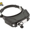 A black magnifying headlamp with an adjustable headband, front light panel, and side adjustment knobs, shown on a white background with a Kiwi Shack logo in the top-left corner.