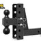 Black heavy-duty drop/rise adjustable dual-ball hitch mount with a channel-style height-adjustment shank, dual hitch balls, stainless steel pin clips/linchpins, a receiver shank with pin hole, and the Kiwi Shack logo watermark.