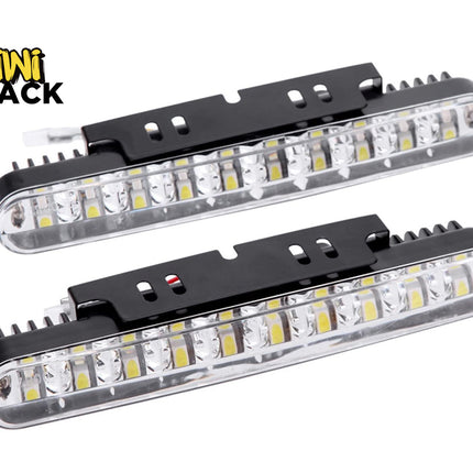Two long LED daytime running lights with black mounting brackets and the "Kiwi Shack" logo in the corner.