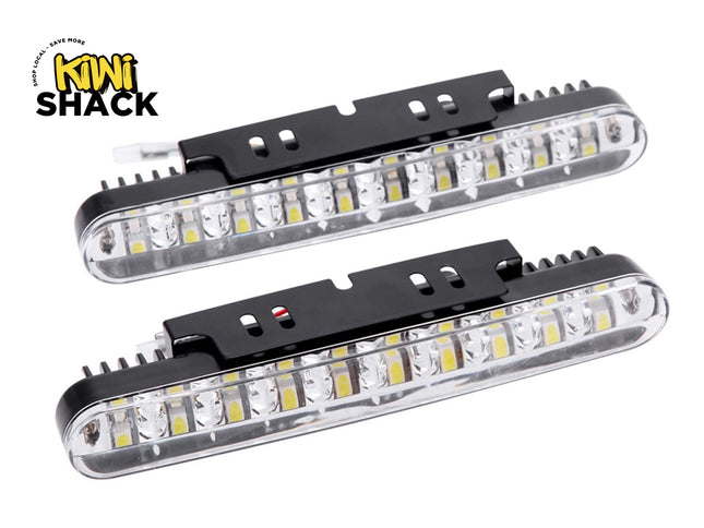 Two long LED daytime running lights with black mounting brackets and the "Kiwi Shack" logo in the corner.