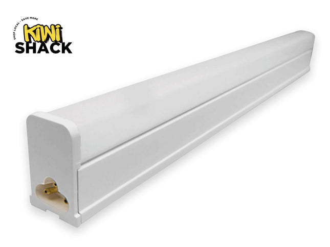 A long white linear LED tube light fixture showing its end connector pins, featuring the "Kiwi Shack" logo in the top-left corner.