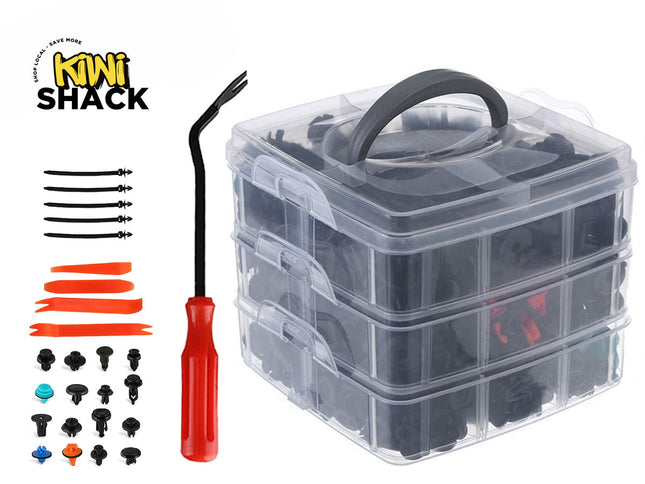 A three-tier clear plastic storage organizer filled with an assortment of automotive push clips and fasteners, displayed alongside a red-handled fastener removal tool, orange trim removal tools, and zip ties against a white background. A "Kiwi Shack" logo appears in the top-left corner.