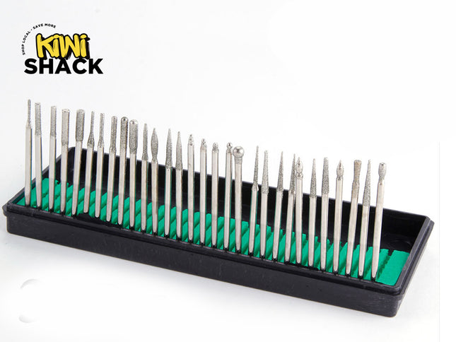 A set of 28 silver diamond drill bits organized in a black plastic tray with a green insert, shown on a white background with the Kiwi Shack logo in the top-left corner.