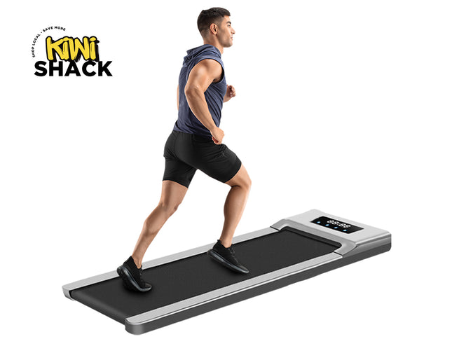 Person using a portable treadmill with Kiwi Shack logo