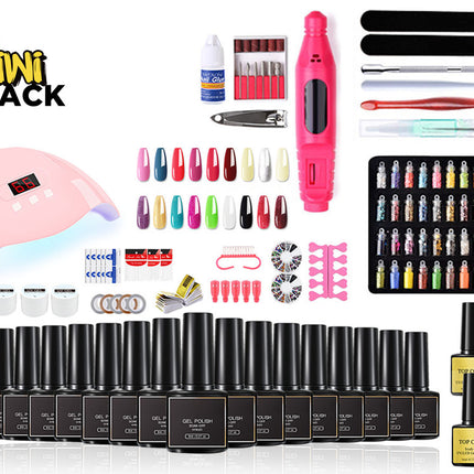 A comprehensive nail art kit by Kiwi Shack displayed on a white background, featuring a pink UV lamp, a pink electric nail file, a black tray of multicolor nail tips, a black tray of nail wraps, multiple black bottles of gel polish, and various application tools.