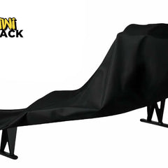 Black protective cover draped over an ergonomic zero-gravity / wellness lounger chair frame with metal base legs, featuring the Kiwi Shack logo watermark.