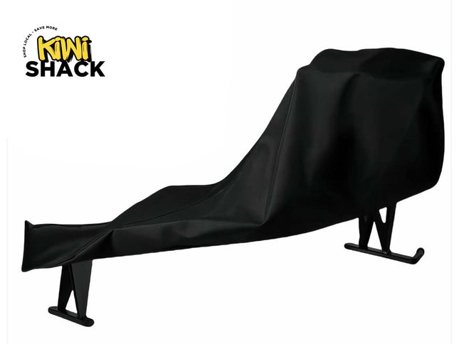 Black protective cover draped over an ergonomic zero-gravity / wellness lounger chair frame with metal base legs, featuring the Kiwi Shack logo watermark.