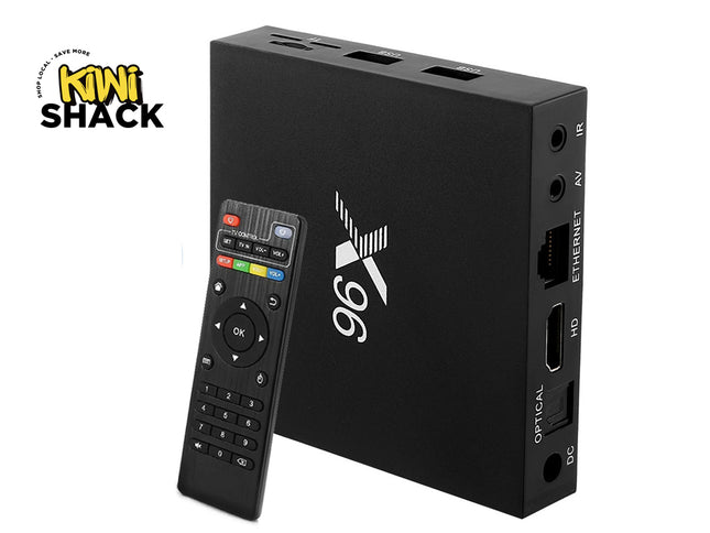 A black streaming media box with a matching remote control, shown on a white background with a Kiwi Shack logo in the top-left corner.