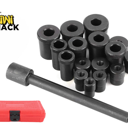 A set of black metal automotive bushing driver and removal tools, including various sized cylindrical adapters and a threaded handle rod next to a closed red storage case, set against a plain background with the "Kiwi Shack" logo in the top left corner.