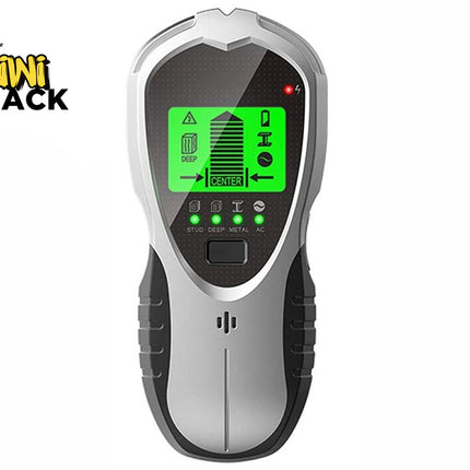 A silver and black digital electronic wall stud finder featuring an active green backlit LCD screen, mode indicator lights, and ergonomic grips, set against a white background. A "Kiwi Shack" logo appears in the top-left corner.