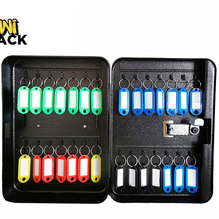 An open black metal key cabinet with a combination lock, featuring multiple rows of hooks holding color-coded key tags in green, blue, yellow, and red against a white background, with the "Kiwi Shack" logo in the upper left corner.