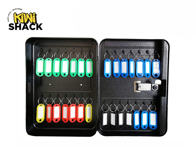 An open black metal key cabinet with a combination lock, featuring multiple rows of hooks holding color-coded key tags in green, blue, yellow, and red against a white background, with the "Kiwi Shack" logo in the upper left corner.