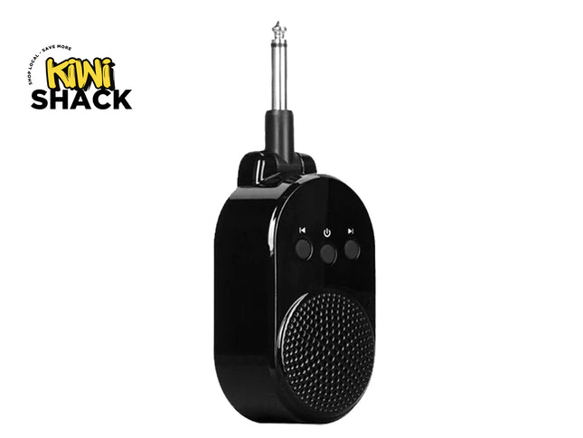 A black portable Bluetooth speaker with a 1/4-inch jack plug antenna, featuring a textured speaker grille and three control buttons on the front, shown on a white background with the Kiwi Shack logo in the top-left corner.