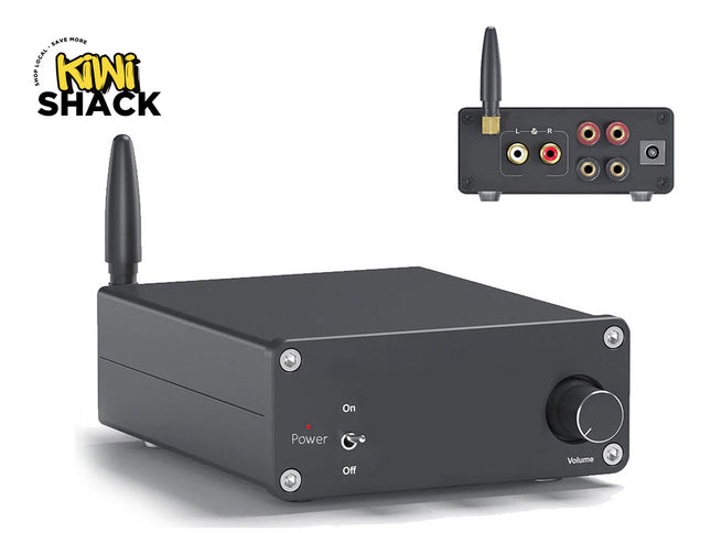 A black rectangular audio receiver or amplifier with a single antenna, shown from the front with a smaller inset view of its rear port panel. The front has a volume knob, On/Off indicators, and the Kiwi Shack logo appears in the top left corner on a white background.