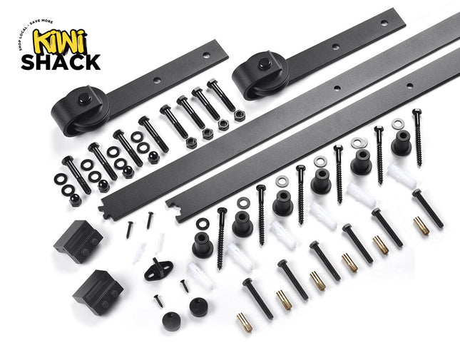 A black sliding barn door hardware kit including tracks, rollers, and mounting fasteners, featuring the "Kiwi Shack" logo in the top-left corner.