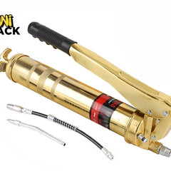 Gold-tone heavy-duty lever-action grease gun with a black-gripped manual handle, accompanied by a flexible black hose attachment and a rigid metal extension nozzle, branded with the "Kiwi Shack" logo in the top-left corner.