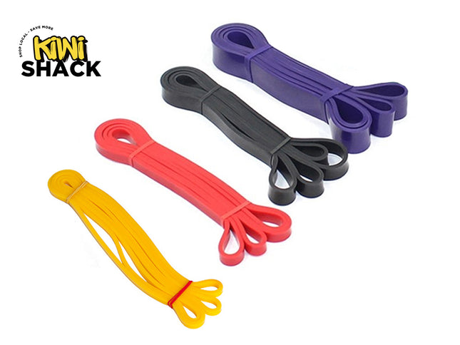 Set of four heavy-duty latex resistance loop bands / pull-up assist bands in yellow, red, black, and purple, neatly bundled with bands and featuring the Kiwi Shack logo watermark.
