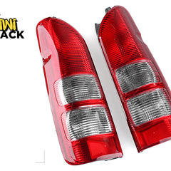 A pair of red and clear aftermarket automotive tail lights with ribbed lens sections, set against a white background with the "Kiwi Shack" logo in the top left corner.