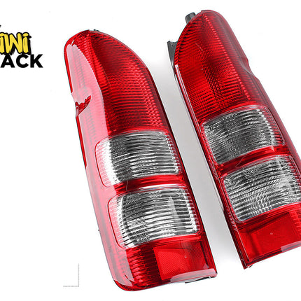 A pair of red and clear aftermarket automotive tail lights with ribbed lens sections, set against a white background with the "Kiwi Shack" logo in the top left corner.