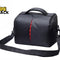 Kiwi Shack protective black waterproof DSLR camera shoulder bag with red interior accent zipper and padded strap.