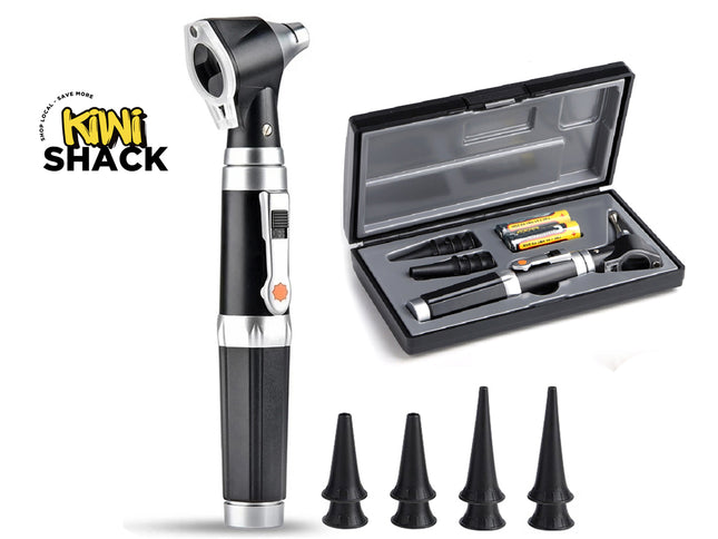 A handheld otoscope examination tool shown upright next to an open black storage case containing accessories, with four black ear tips arranged below on a white background. A Kiwi Shack logo appears in the upper left.