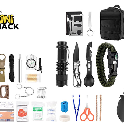 A comprehensive outdoor survival kit from Kiwi Shack, featuring a wide array of survival tools, first aid items, and accessories neatly arranged on a solid white background. The kit includes a black tactical backpack, a black folding shovel, a black flashlight, a black multi-tool knife, a green paracord bracelet, a black whistle, a compass, a first aid kit, and various other survival accessories.