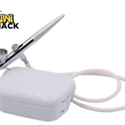 Airbrush with white case and cable on a white background, featuring Kiwi Shack logo.