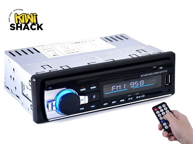 A single-DIN car stereo head unit with Bluetooth, FM radio receiver, USB port, and a handheld remote control, featuring the "Kiwi Shack" logo in the top-left corner.