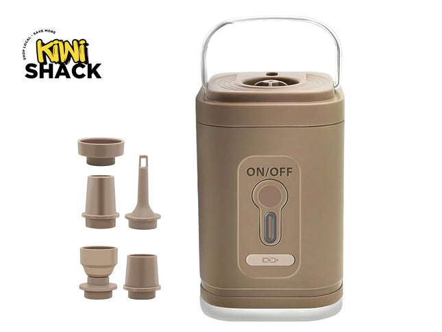 Brown portable electronic pump or air inflator unit with a carrying handle, ON/OFF push button, charging indicator port, five interchangeable nozzle attachments on the left, and Kiwi Shack logo in top left.