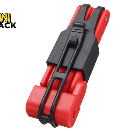 Compact red and black folding bicycle lock / multi-segment folding lock secured with a black silicone/rubber carrying bracket and belt mount, featuring the Kiwi Shack logo watermark..