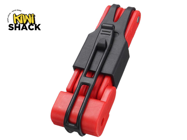 Compact red and black folding bicycle lock / multi-segment folding lock secured with a black silicone/rubber carrying bracket and belt mount, featuring the Kiwi Shack logo watermark..