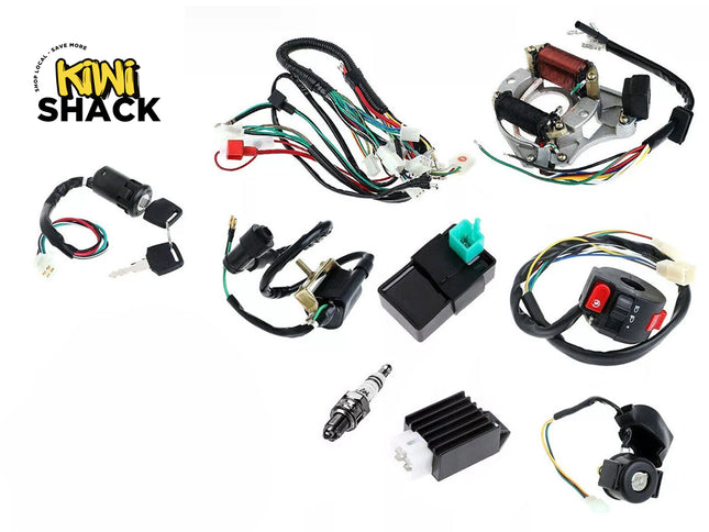 Complete dirt bike/ATV electrical ignition overhaul kit including main wiring harness, stator/magneto coil, CDI box, ignition coil, spark plug, voltage regulator, handlebar switch, and ignition switch with keys, featuring Kiwi Shack logo in top left.