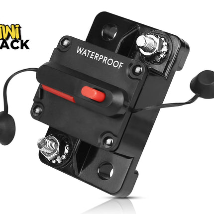 Waterproof black DC circuit breaker with dual threaded stud terminals, a manual red trip/reset switch lever, two side-attached rubber protective caps, surface mounting base, and Kiwi Shack logo in top left.