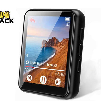 A compact black digital MP3 player with a touchscreen display showing a music playback interface with track controls and album art of a coastal landscape, featuring a "Kiwi Shack" logo in the top left corner.