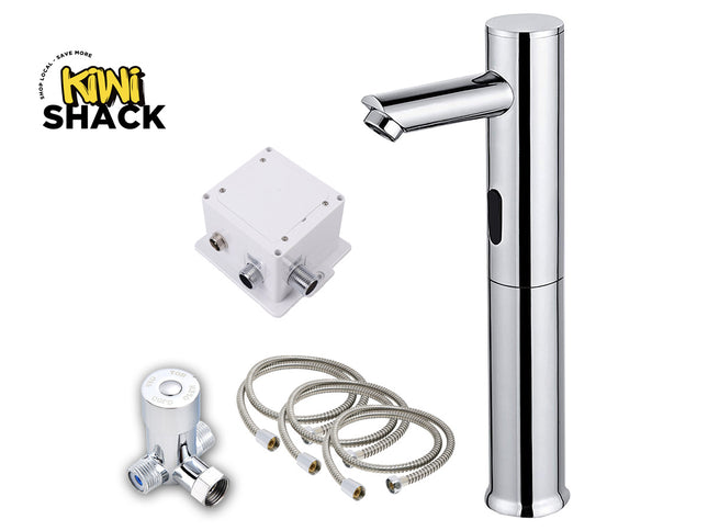 A chrome single-handle bathroom faucet shown with a white electronic sensor box, a white shut-off valve, and two braided supply hoses on a white background. The 'Kini Shack' logo is visible in the top-left corner.