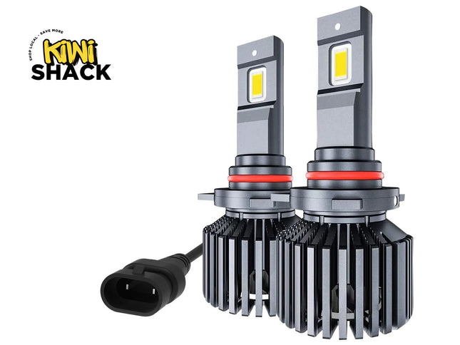 Two Kiwi Shack LED car light bulbs with a black power connector, shown on a white background with the Kiwi Shack logo in the top left corner.