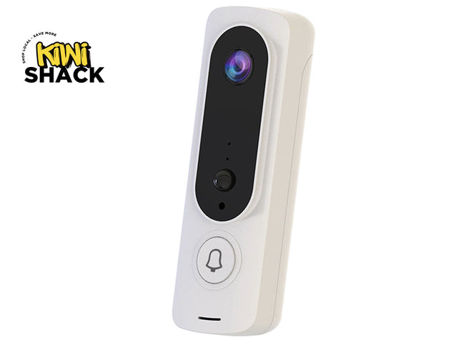 A white smart video doorbell with a black camera lens panel and a silverbell button, shown on a white background with a Kiwi Shack logo in the top-left corner.